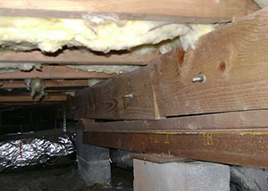 sagging crawl space with wooden shimming a West Lafayette crawl space