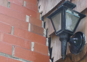 A tilting chimney in Westfield showing serious foundation damage.