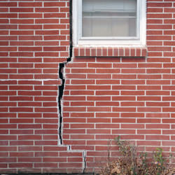 A foundation with a large crack that's wider at the top than on the bottom in Avon