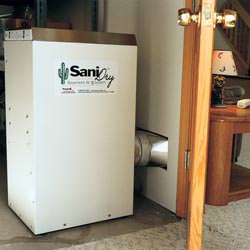 A basement dehumidifier with an ENERGY STAR® rating ducting dry air into a finished area of the basement  in Huntington